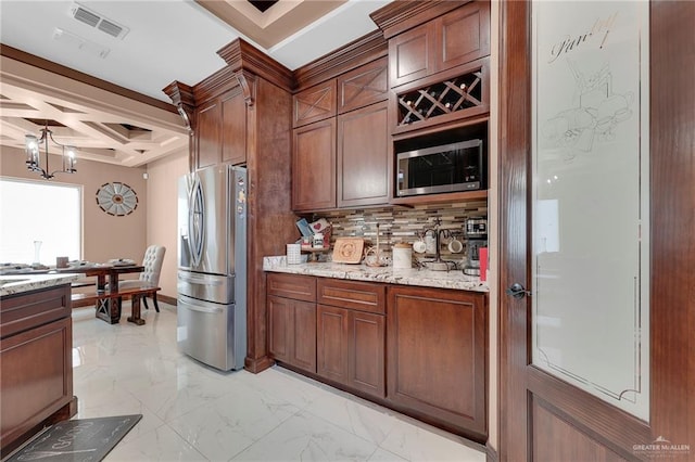 2000 Shelby St, Mission, TX 78572 - kitchen featuring stainless steel appliances, coffered ceiling, light marble finish floors, tasteful backsplash, and light stone countertops