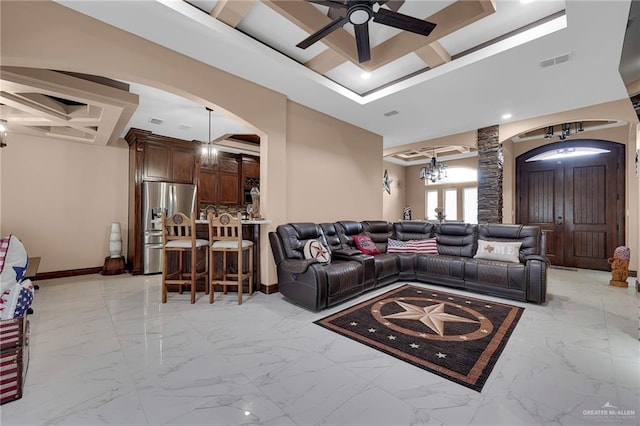 2000 Shelby St, Mission, TX 78572 - living room featuring arched walkways, ceiling fan, coffered ceiling, baseboards, and light marble finish floors