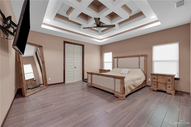 2000 Shelby St, Mission, TX 78572 - bedroom featuring beamed ceiling, baseboards, wood finished floors, ceiling fan, and coffered ceiling