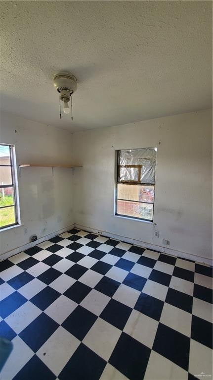 empty room with a textured ceiling