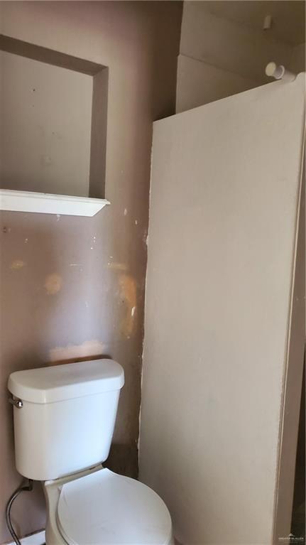 601 E Ricky Crossland Ave, Elsa, TX 78543 - bathroom featuring toilet
