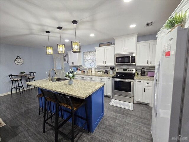 442 La Villita Dr, Donna, TX 78537 - kitchen with white cabinets, a sink, recessed lighting, and appliances with stainless steel finishes