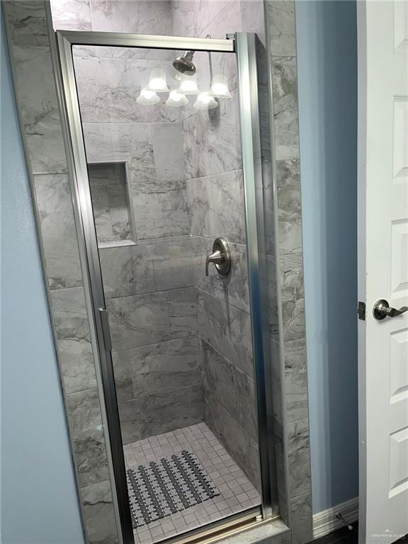 442 La Villita Dr, Donna, TX 78537 - full bathroom featuring a shower stall and a notable chandelier