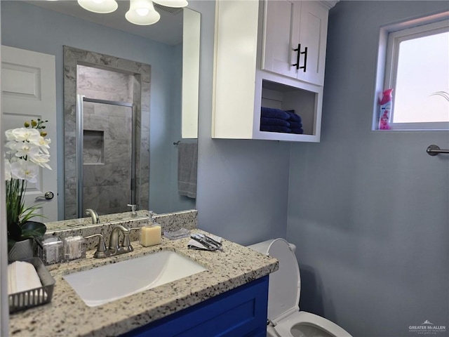 442 La Villita Dr, Donna, TX 78537 - bathroom featuring vanity, toilet, and a stall shower