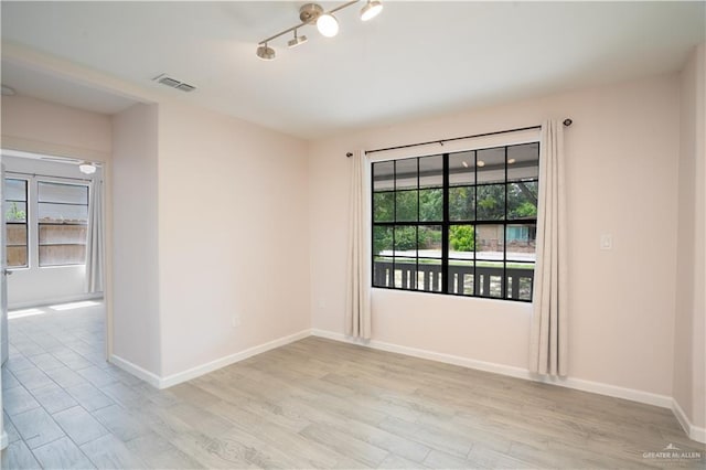 218 W Eller Ave, Pharr, TX 78577 - spare room with light wood-type flooring and baseboards