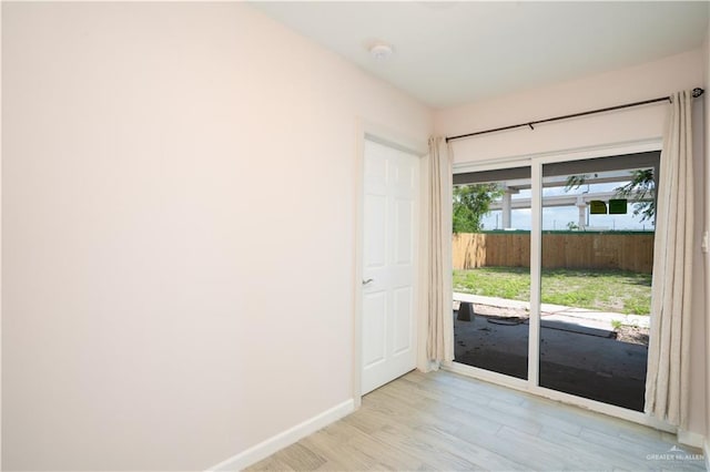 218 W Eller Ave, Pharr, TX 78577 - doorway with light wood-type flooring and baseboards