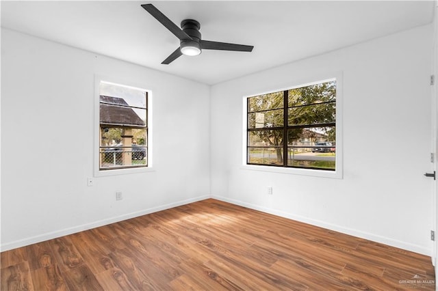 unfurnished room featuring hardwood / wood-style flooring and ceiling fan