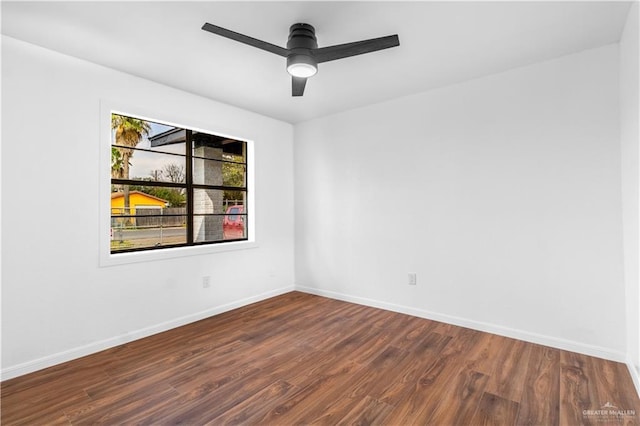 unfurnished room with hardwood / wood-style flooring and ceiling fan