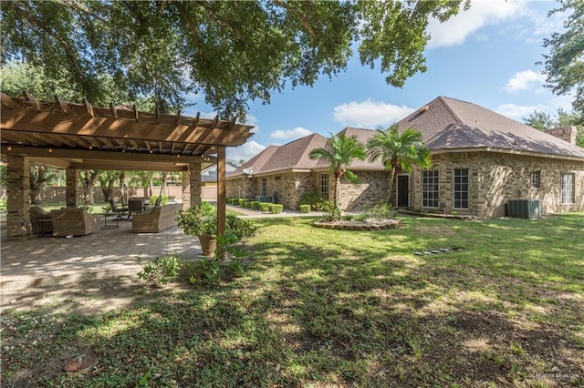 view of yard with a pergola, outdoor lounge area, a patio, and central AC unit