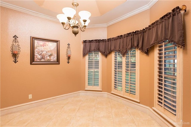 tiled empty room with a tray ceiling, crown molding, and an inviting chandelier