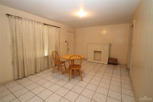 unfurnished dining area with light tile patterned floors