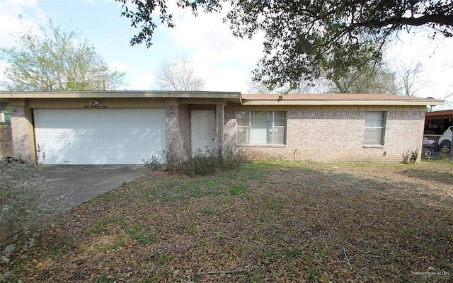 ranch-style house with an attached garage, concrete driveway, and brick siding