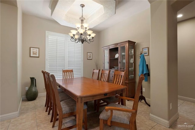 5109 Quince Ave, Mcallen, TX 78501 - dining area with a chandelier, light tile patterned flooring, baseboards, and a raised ceiling