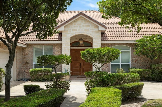 5109 Quince Ave, Mcallen, TX 78501 - view of front facade featuring a tiled roof and stone siding