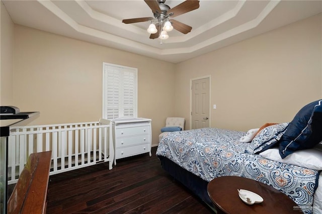 5109 Quince Ave, Mcallen, TX 78501 - bedroom with wood-type flooring, a tray ceiling, and ceiling fan
