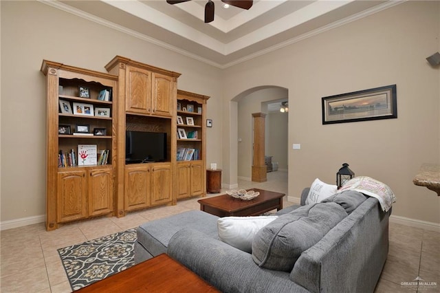 5109 Quince Ave, Mcallen, TX 78501 - living area featuring a ceiling fan, light tile patterned flooring, arched walkways, a raised ceiling, and crown molding