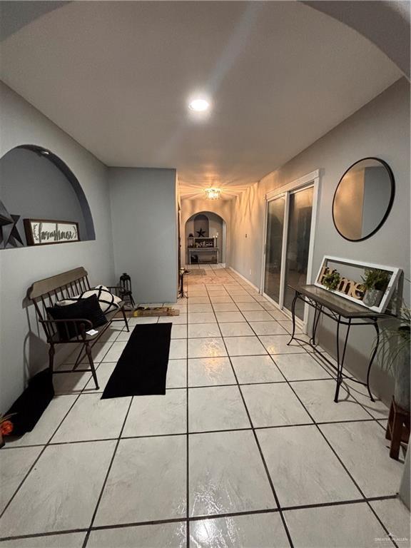858 S La Homa Rd S, Mission, TX 78573 - hallway featuring arched walkways, light tile patterned floors, and recessed lighting