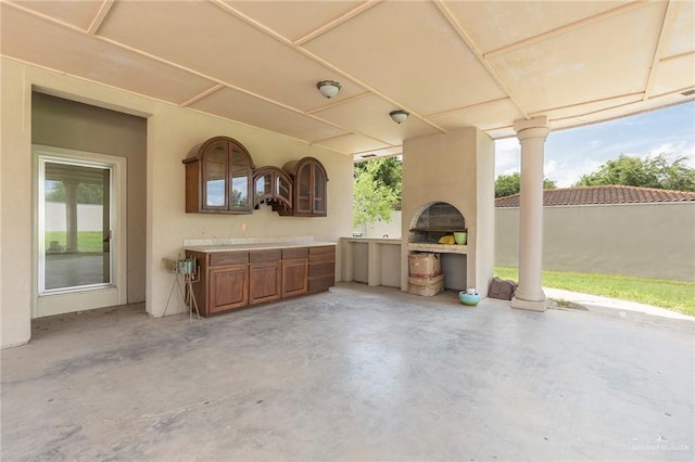 view of patio / terrace featuring an outdoor fireplace