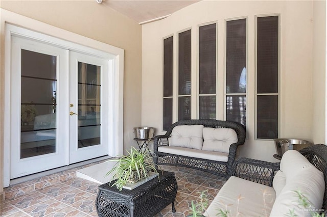 view of patio / terrace with french doors and an outdoor living space