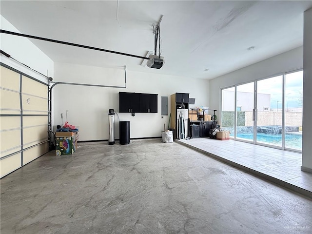 garage featuring a garage door opener and electric panel