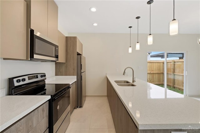 1901 W Violet Dr, Pharr, TX 78577 - kitchen featuring stainless steel appliances, modern cabinets, a sink, light tile patterned floors, and recessed lighting