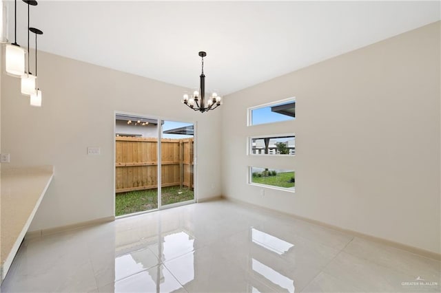 1901 W Violet Dr, Pharr, TX 78577 - unfurnished dining area with a chandelier, tile patterned floors, and baseboards