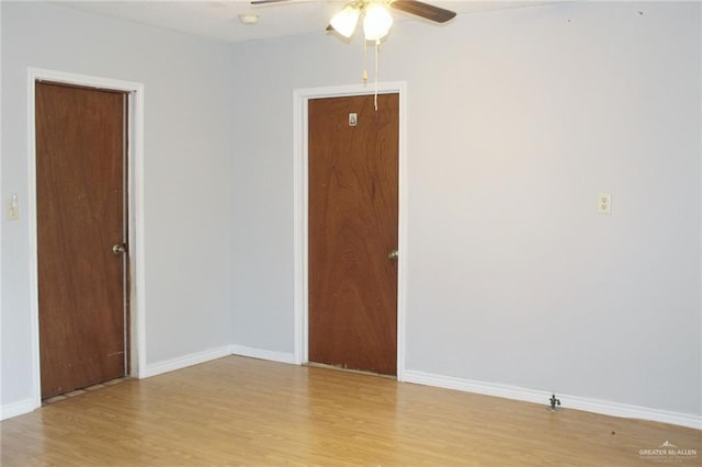 unfurnished room featuring light wood-type flooring and ceiling fan