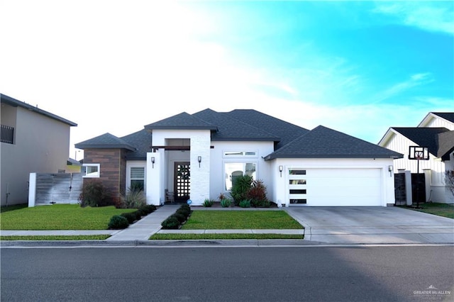 view of front of home featuring a garage and a front lawn