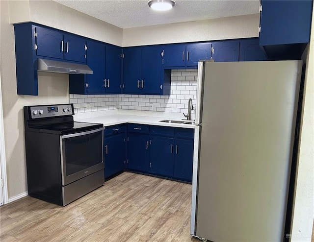 kitchen featuring stainless steel electric range, a sink, freestanding refrigerator, light wood-type flooring, and under cabinet range hood