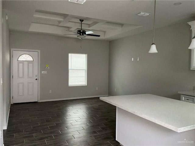 interior space featuring baseboards, visible vents, coffered ceiling, a ceiling fan, and dark wood-style floors