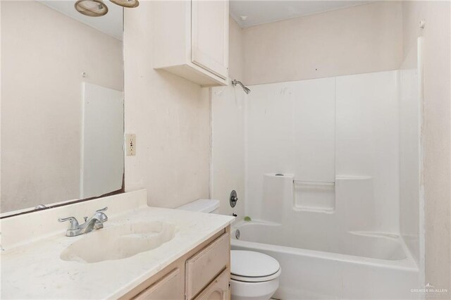 full bathroom with vanity, bathing tub / shower combination, and toilet