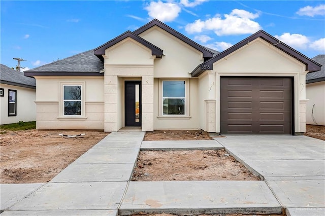 single story home featuring a garage