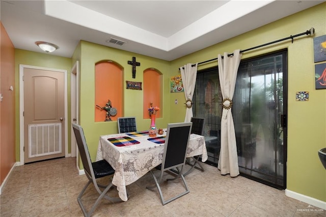 1904 E Hibiscus Ave, Hidalgo, TX 78557 - dining area featuring baseboards, tile patterned floors, and a raised ceiling