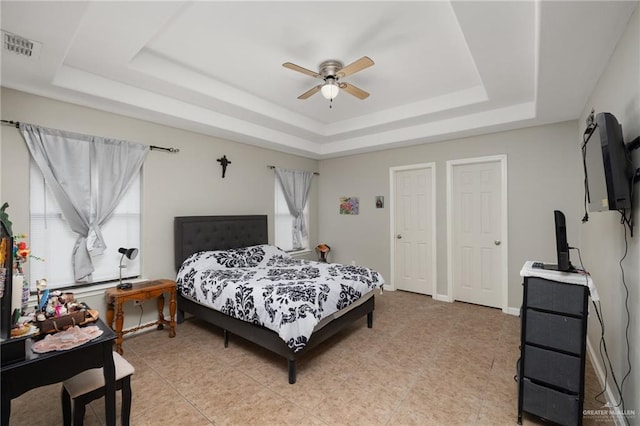 1904 E Hibiscus Ave, Hidalgo, TX 78557 - bedroom featuring a raised ceiling, ceiling fan, and light tile patterned floors