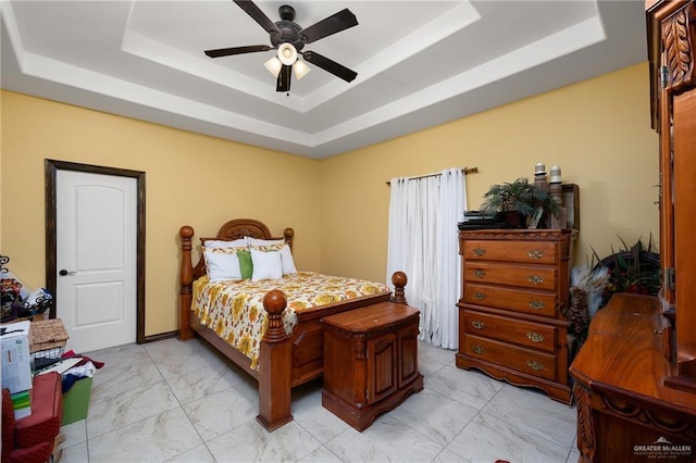 5514 N Minnesota Rd, Mission, TX 78574 - bedroom featuring a raised ceiling, light marble finish flooring, and ceiling fan