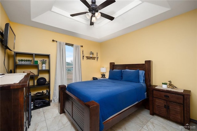 5514 N Minnesota Rd, Mission, TX 78574 - bedroom featuring a raised ceiling, light marble finish floors, and a ceiling fan