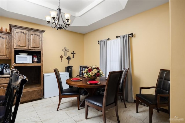 5514 N Minnesota Rd, Mission, TX 78574 - dining room featuring a raised ceiling and a chandelier