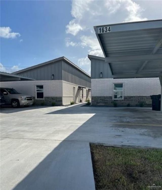 view of side of home featuring a carport