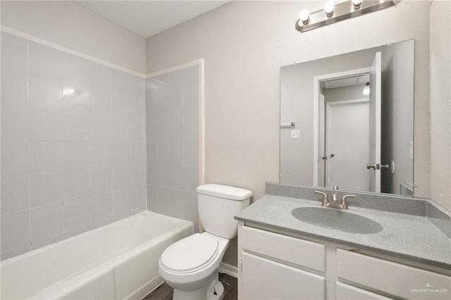 full bathroom featuring shower / bath combination, vanity, and toilet