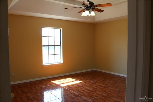 tiled empty room with ceiling fan