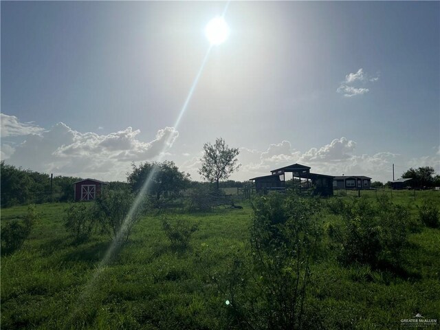 view of yard with a rural view