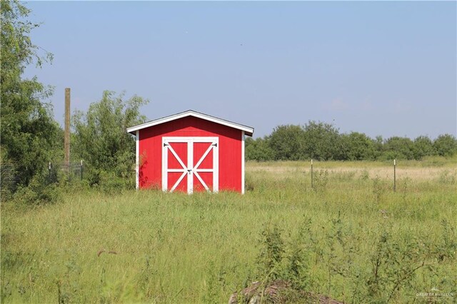 view of outdoor structure featuring a rural view