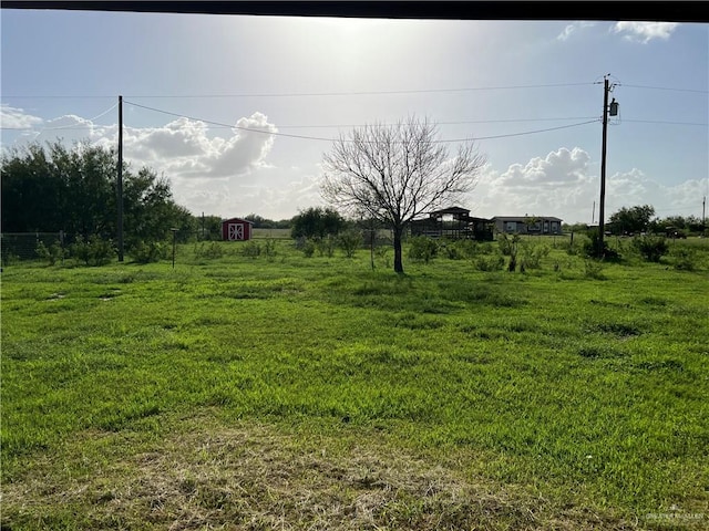 view of yard with a rural view