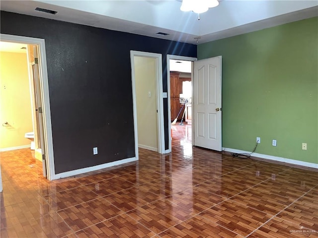 unfurnished bedroom featuring dark hardwood / wood-style floors