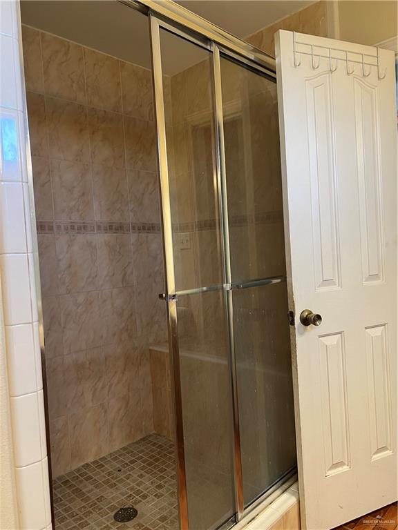 bathroom featuring an enclosed shower