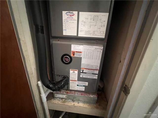 1116 S Orange St, Mercedes, TX 78570 - utility room featuring heating unit