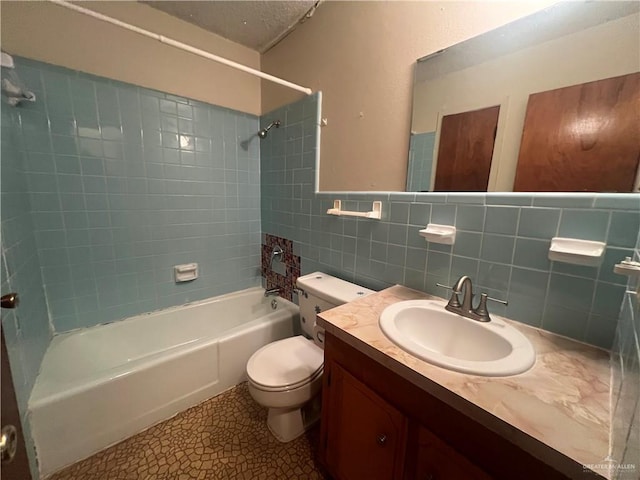 1116 S Orange St, Mercedes, TX 78570 - bathroom featuring bathing tub / shower combination, vanity, tile walls, and wainscoting