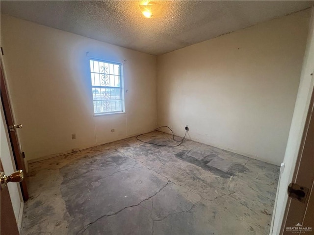 1116 S Orange St, Mercedes, TX 78570 - spare room with a textured ceiling