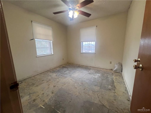 1116 S Orange St, Mercedes, TX 78570 - spare room featuring healthy amount of natural light, ceiling fan, and a textured ceiling