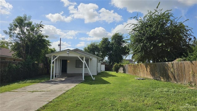 view of front of house with a front lawn and a carport